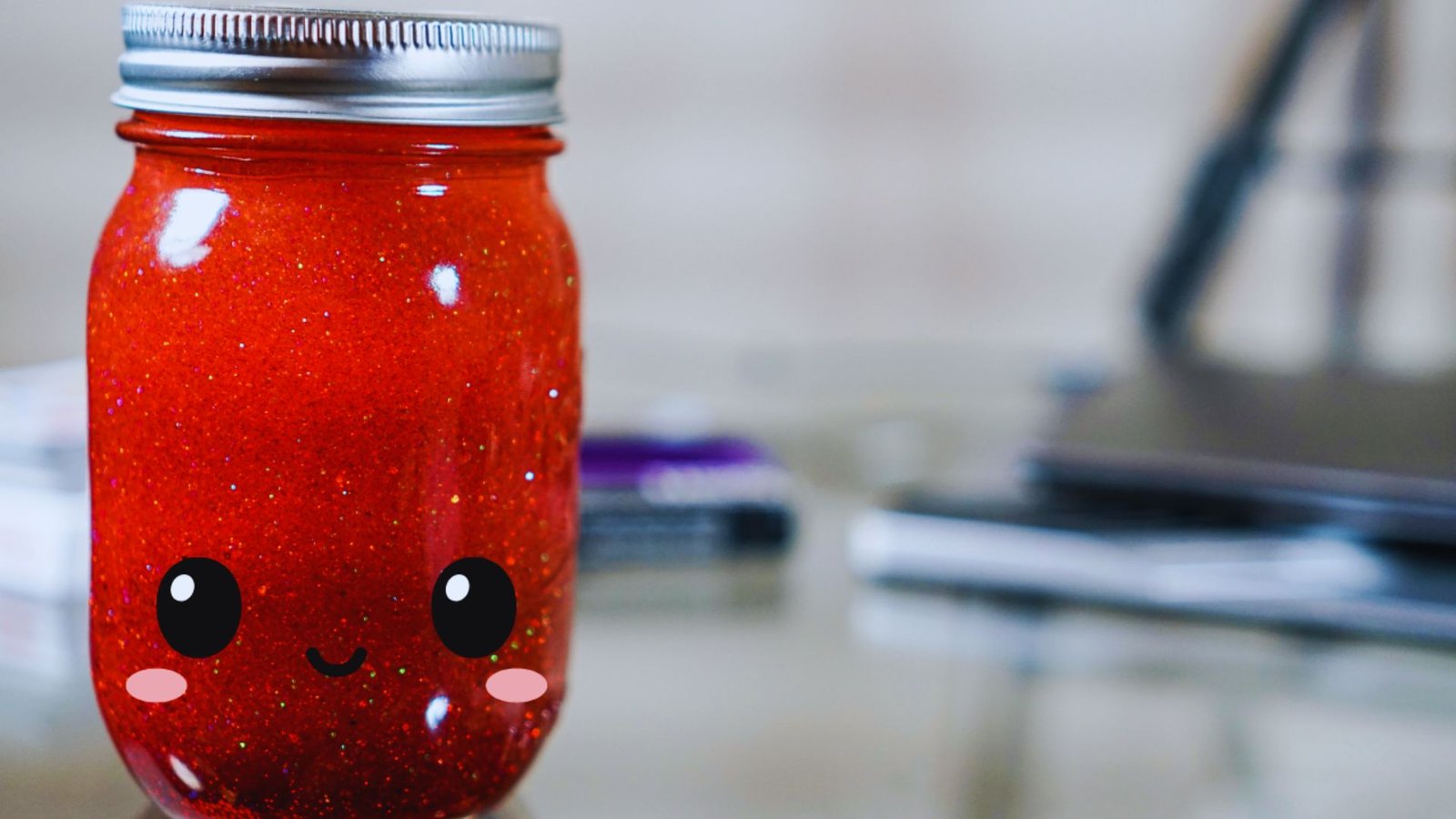 A jar featuring a whimsical face design, showcasing expressive eyes and a smiling mouth.